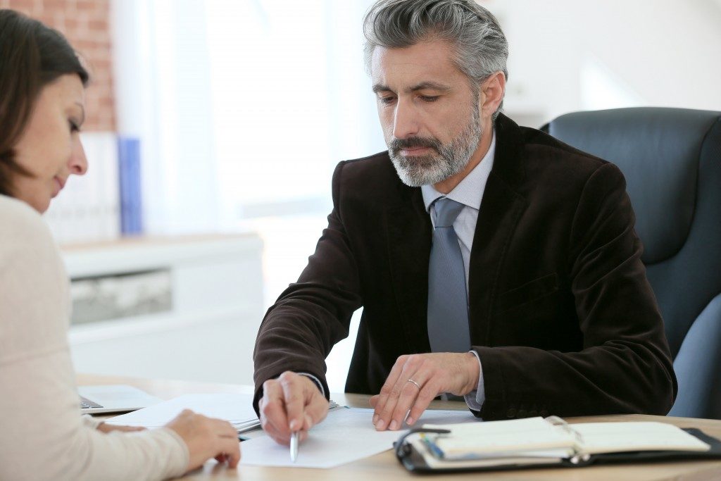 Woman signing the contract