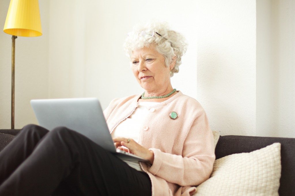 Elderly woman using a laptop