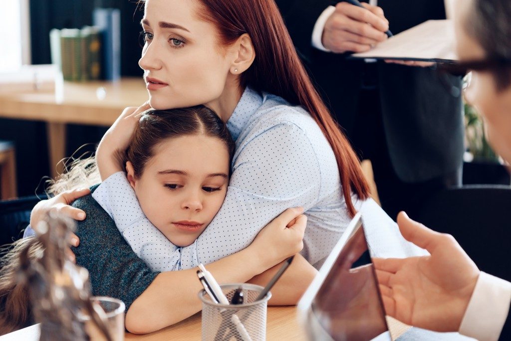 a mother holding her child