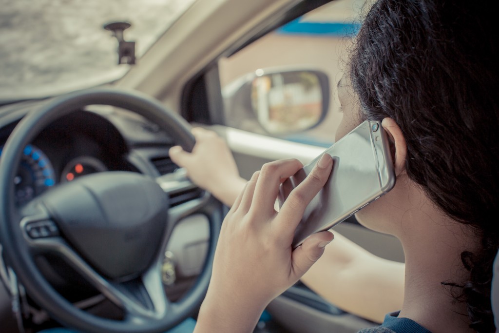 Woman on the phone while driving