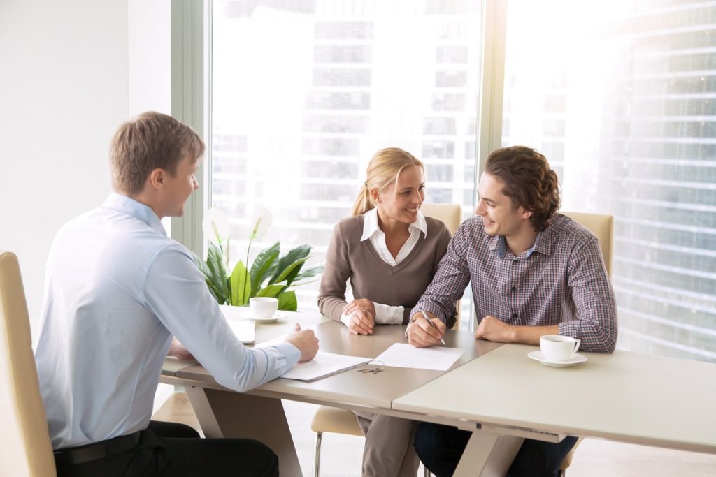 Couple with a real estate agent