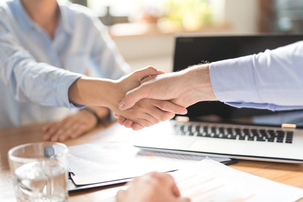 Two people handshaking