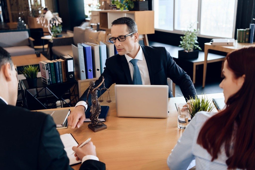 Lawyer talking with couple