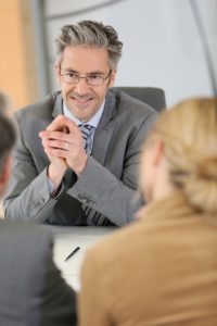 Lawyer talking with couple