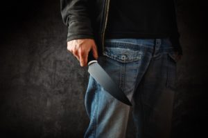 a killer person with sharp knife