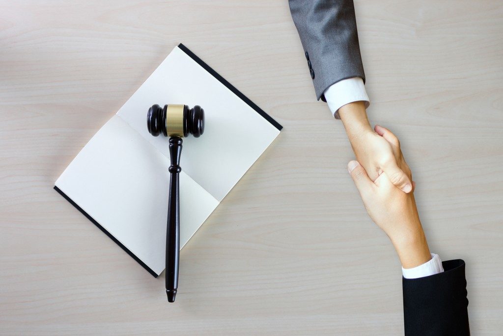 lawyer and client shaking hands