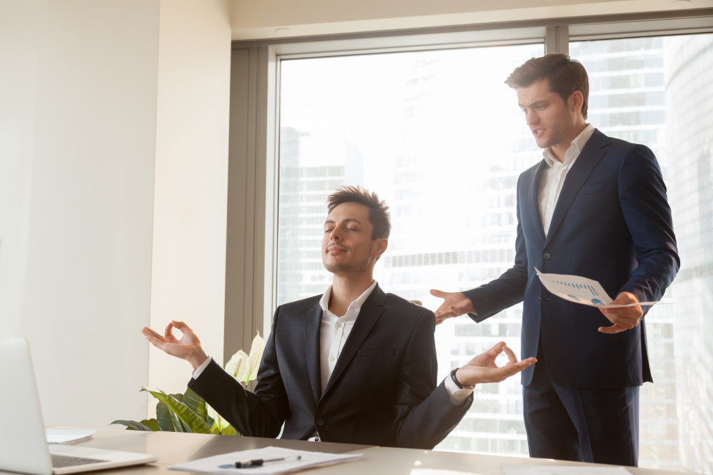 employee meditating at workplace