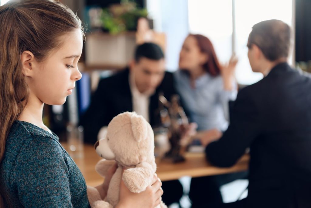 little girl holding her stuffed toy