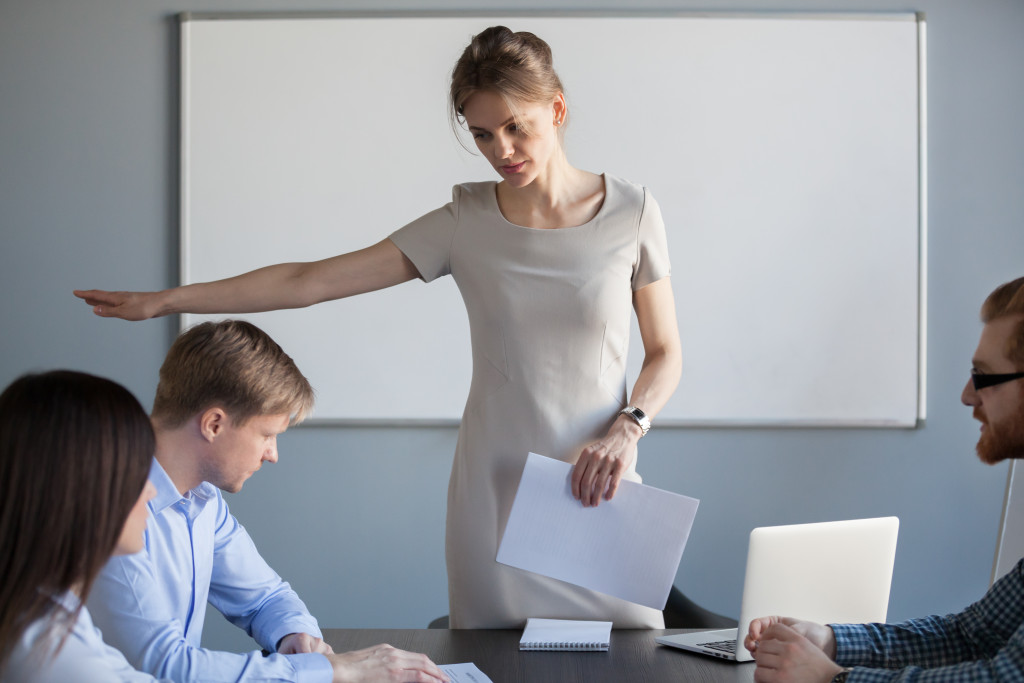 woman telling her employees to work