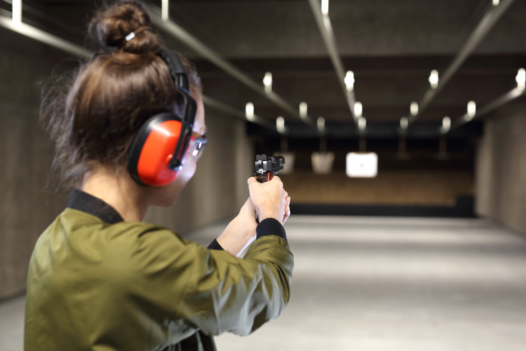 a woman in a shooting range