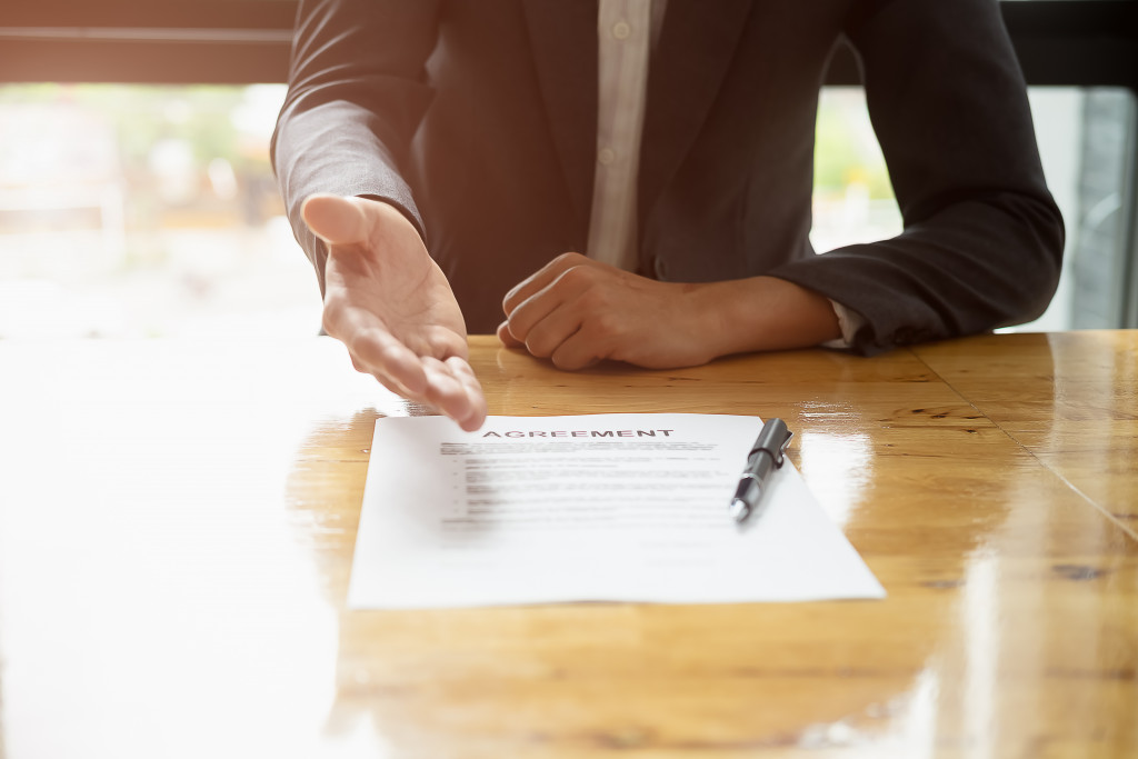 agreement form shown by businessman