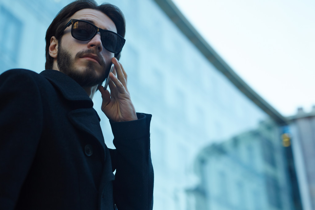 man in black with blurred background